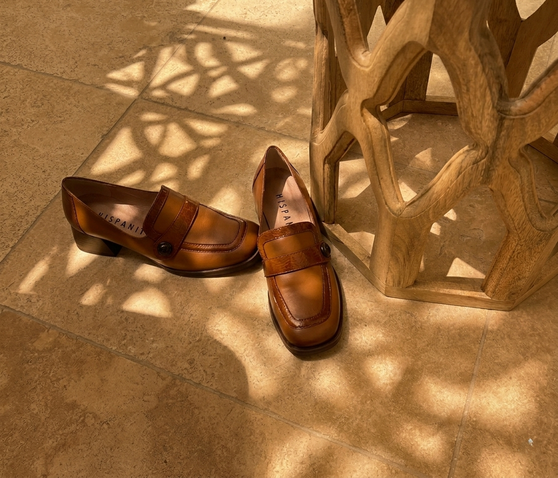 Tan leather buckle loafers, outdoor styled shot