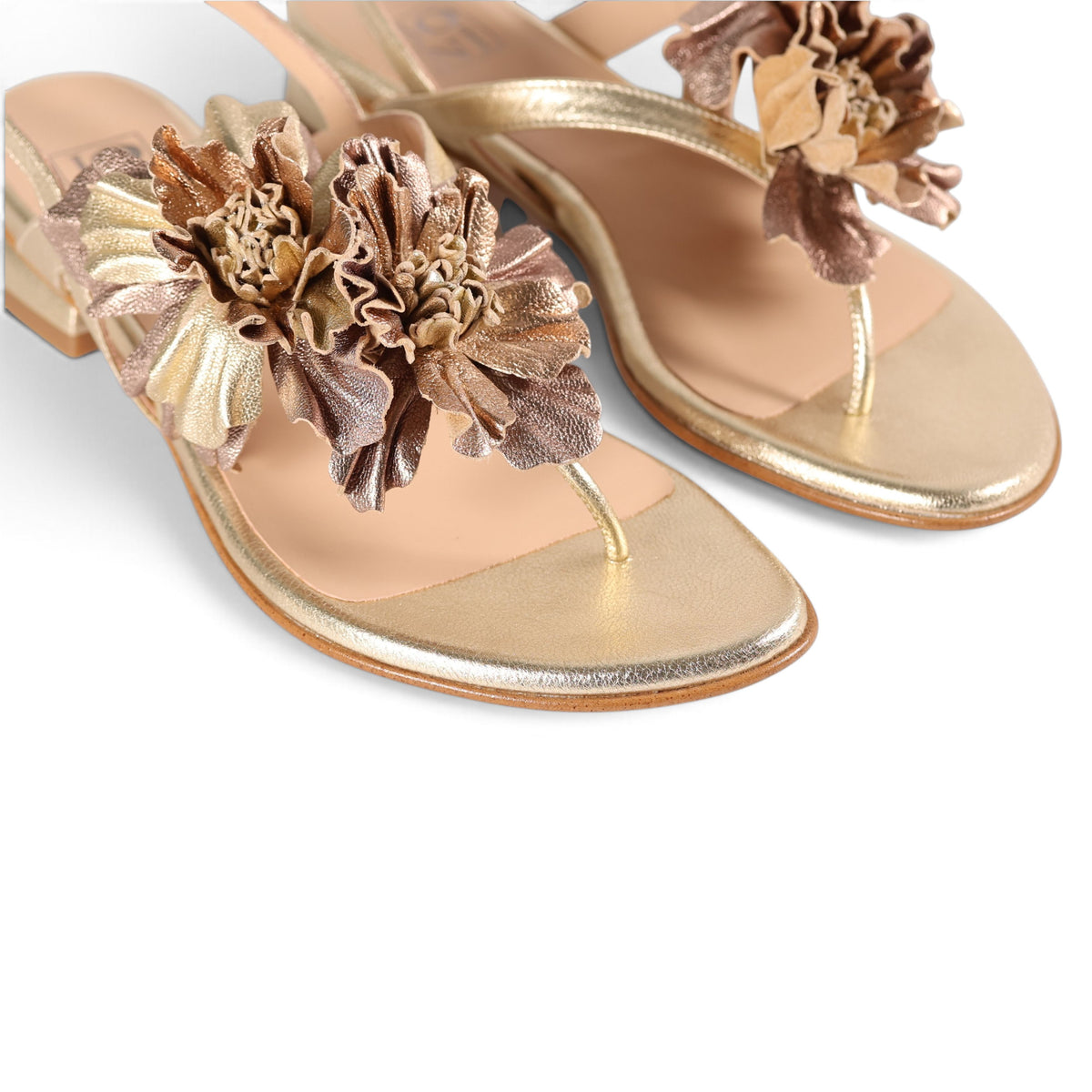 Paloma Gilded Trio gold metallic leather sandal, three-quarter view showing floral detail, by Estela