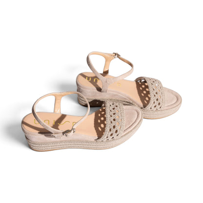 Model wearing Carmela Natural woven platform wedge sandals, lifestyle shot, by Estela