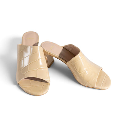 Alba Champagne Sand croc-embossed leather mule, angled close-up view, by Estela
